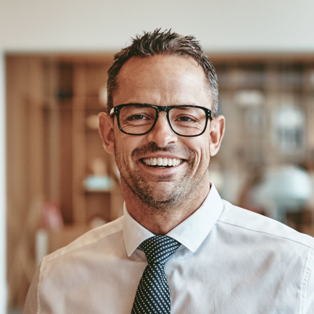 Smiling Mature Businessman Standing Alone In An Of Y89VGBD 1 1